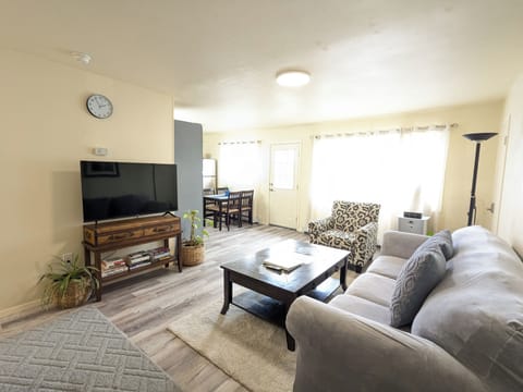 Comfortable living room that sits four. Seamless open concept design.  