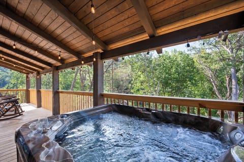 Hot Tub with a View – Soak in the bubbling hot tub in a serene mountain setting