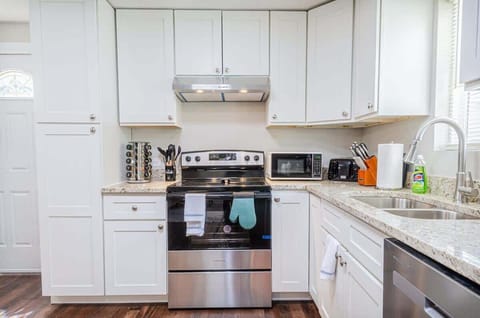 This bright and airy kitchen is the perfect place to prepare your favorite meals. With plenty of counter space, modern appliances, and ample storage, you'll have everything you need to cook up a delicious meal.