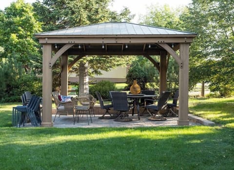 Ample backyard seating for dining in the backyard under the gazebo.