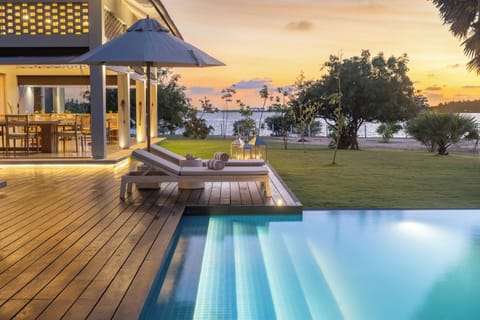 Outdoor pool, open 7:00 AM to 7:00 PM, pool umbrellas, sun loungers