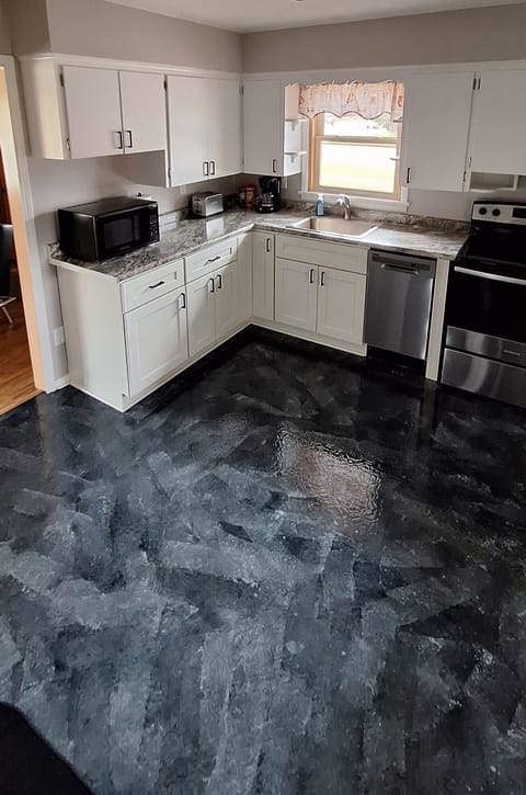 Kitchen includes microwave, toaster, coffee maker, oven and dishwasher