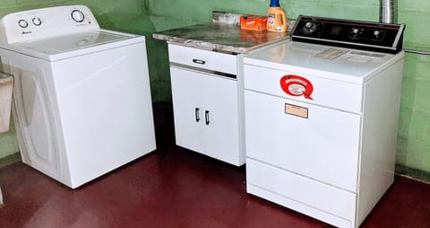 Laundry room with full size washer and dryer.