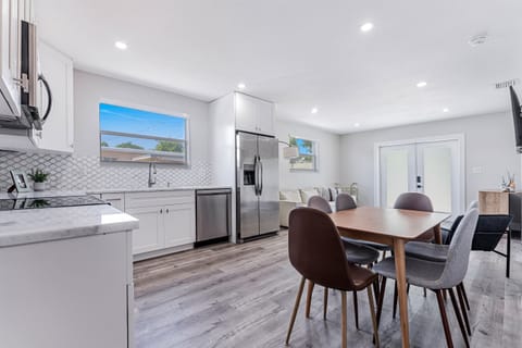 Catch up on work emails at the dining table that doubles as a work station.