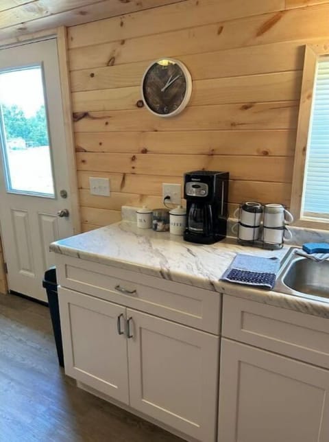 Coffee maker with complimentary coffee, sugars and creamers
