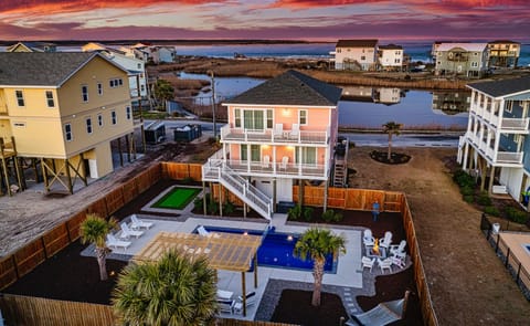 Tickled Pink is a luxury beach house offering upscale coastal living just steps from the white sandy shores.