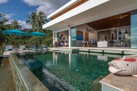 `Soak up the sun on plush loungers by the pool, the perfect spot for relaxation.`
