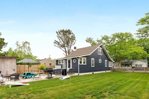 Spacious private backyard with patio seating, dining and room to relax