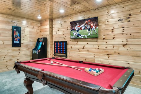 Awesome game room with multicade, giant Connect Four, pool table and smart TV.