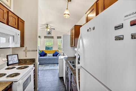 Your kitchen has everything: a stove, microwave, dishwasher, and a full fridge.