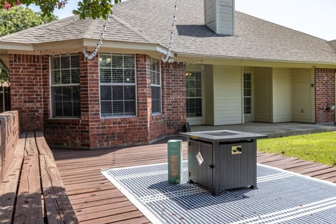 Settle in with friends and family in the large backyard by the fire pit. 