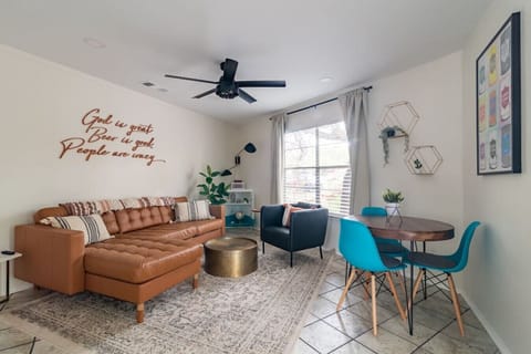 Enjoy the living room area. Get cozy on the leather sectional or enjoy a bite to eat at the dining table.