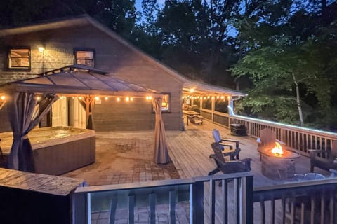 Large deck and covered front porch for everyone to enjoy the serenity of Family Time Cabin
