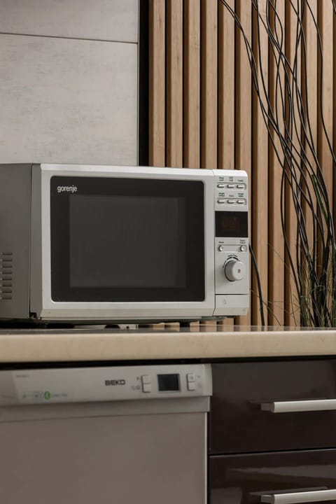 A close-up of a built-in microwave and cabinetry, blending practicality with design.

