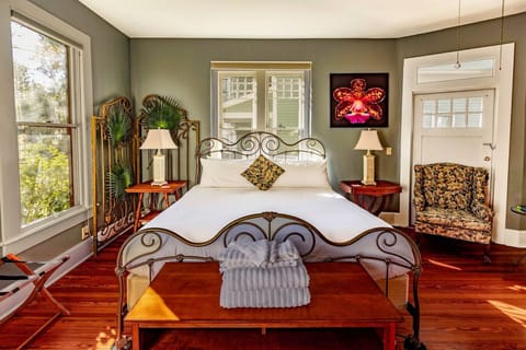 King bed in a bright room (with shades)