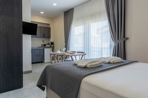 Premium bedding, desk, laptop workspace, blackout drapes