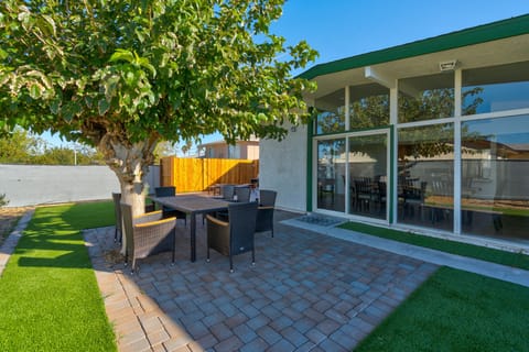 Lush Backyard with Firepit, Dining, Games like golf pong/cornhole, and BBQ Grill
