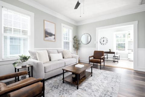 Bright and spacious family room featuring a comfortable queen-size sleeper sofa.