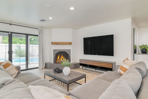 Modern interior design with sleek finishes and curated decor. (Fireplace is inoperable)