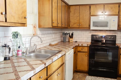 Enjoy cooking in our fully stocked kitchen