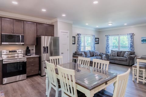 Kitchen - Kitchen with new stainless steel appliances and dining table with seating for 6.