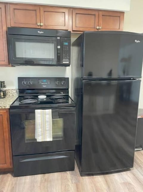Full-sized refrigerator, oven, cooktop and microwave oven. 