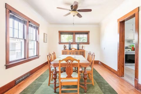 Dining room with seating for 6, plus 8 folding chairs to extend the gathering.
