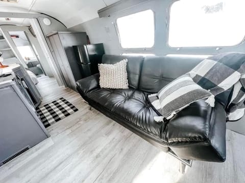 Futon can be folded down to make another bed. 