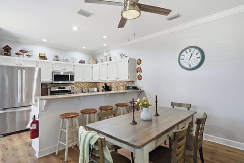 Grab a spot at the kitchen bar. Perfect for hanging out and socializing