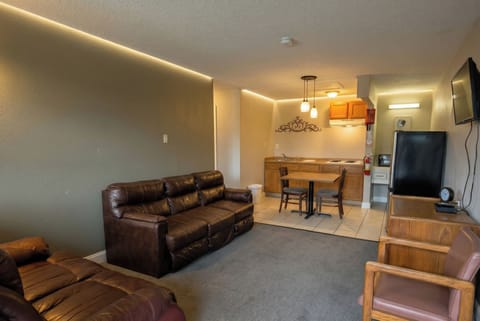 Suite, 1 King Bed, Non Smoking, Kitchenette | 1 bedroom, minibar, desk, iron/ironing board