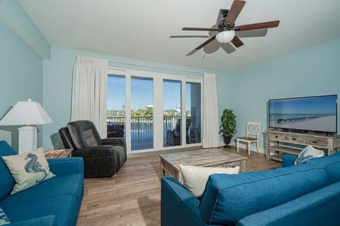 Open Concept Living Area with Sleeper Sofa, Flat Screen TV, Lake Views and Balcony Access