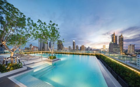 Outdoor pool, open 6:00 AM to 10:00 PM, pool umbrellas, sun loungers