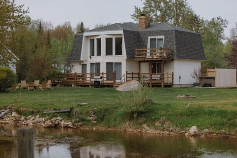 Channel front property with direct access to Thunder Bay, offering serene views and outdoor adventures.