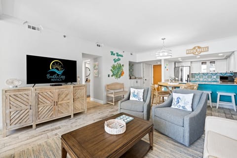 Bright living space flows to dining and a private balcony with views of the pool and sparkling Gulf.

Professionally Managed by
Breathe Easy Rentals