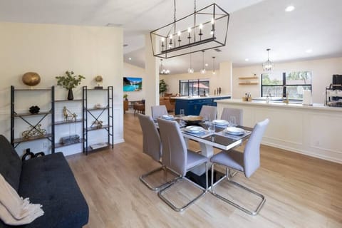 Elegant contemporary dining room with seating for six. Gather for family meals.
