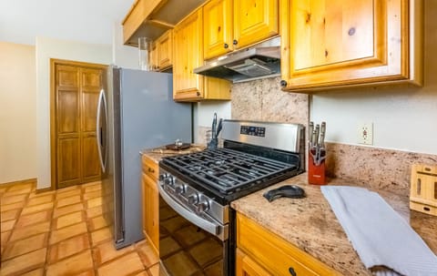 Gas stove and freezer with ice maker are just steps from your back porch