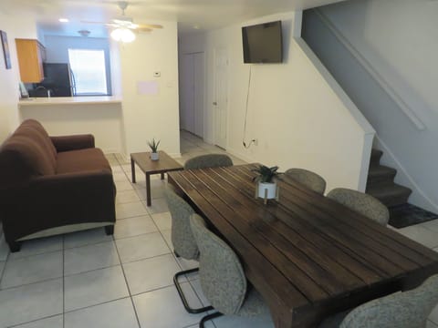 Three sofa bed couch. Large dining table with 6 seats. 50in smart TV, ceiling fa