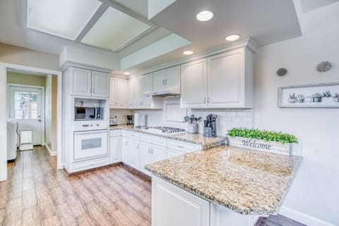 Gather and create memories around this bright, inviting culinary space.