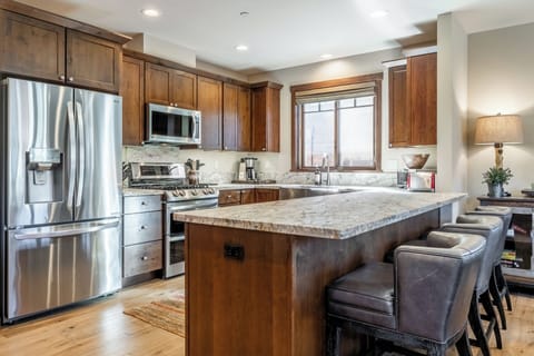 The fully equipped kitchen at Bear’s Den makes cooking for a group simple, with generous counter space and quality appliances.