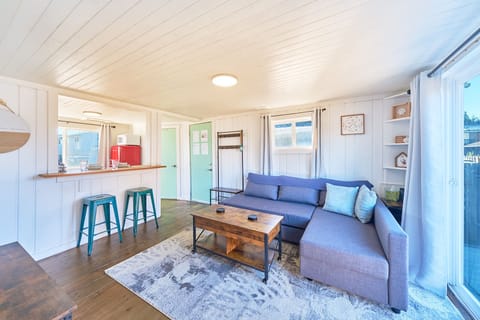 This bungalow can graciously host up to four adults, with the addition of the queen pull out couch, ensuring ample space for everyone to enjoy.