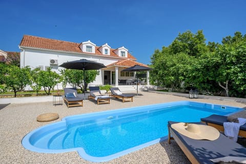 Croatia luxury family villa Essencia Milna Brac with private heated pool for vacation and rent 
