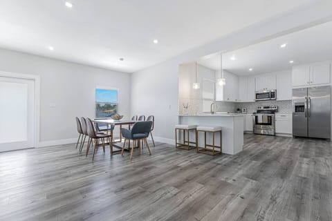 The dining table makes perfect for hosting dinner, in the open kitchen with two additional bar stools.