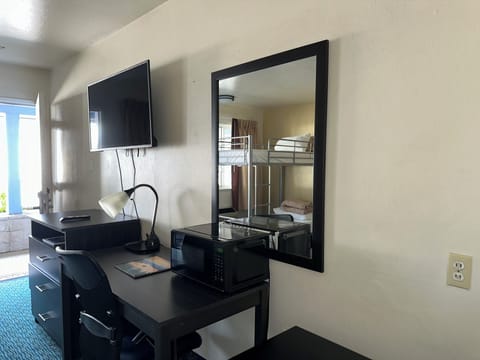 Family room with 1 Queen Bed and 1 Bunk Bed | Blackout drapes, iron/ironing board, free WiFi, bed sheets