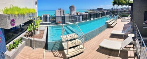 Apartment | Pool | Indoor pool, pool umbrellas, sun loungers