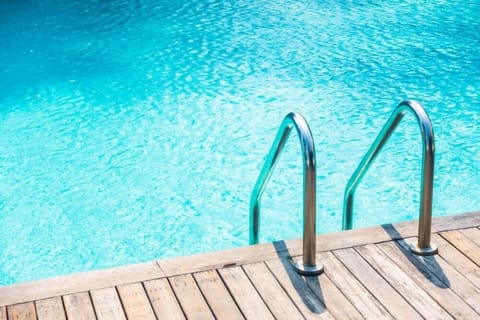 Outdoor pool, open 6:00 AM to 10:00 PM, pool umbrellas, sun loungers