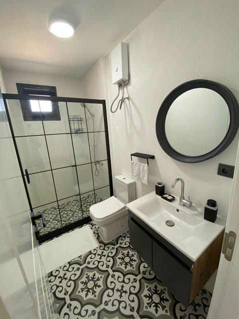 Standard Lower Floor | Bathroom | Shower, hair dryer, slippers, towels