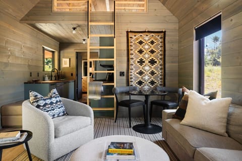 The main living area includes a table that is perfect for sining, playing games and even working.