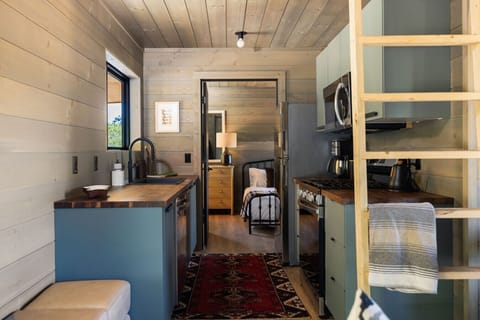 The fully equipped kitchen includes a dishwasher, fridge, range, microwave, espresso maker and all the dishes and cookware you need.