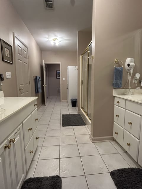 Guest bathroom with entry from foyer and front bedroom. Toilet paper provided!
