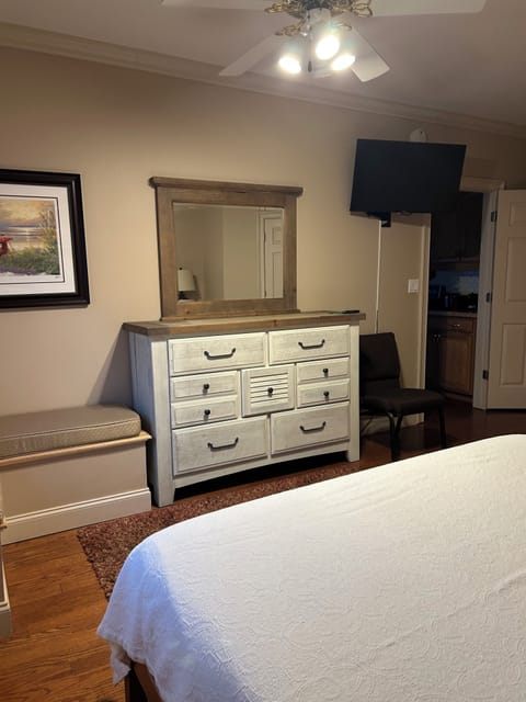 There is a lot of storage for clothing and a bench for sitting or luggage.